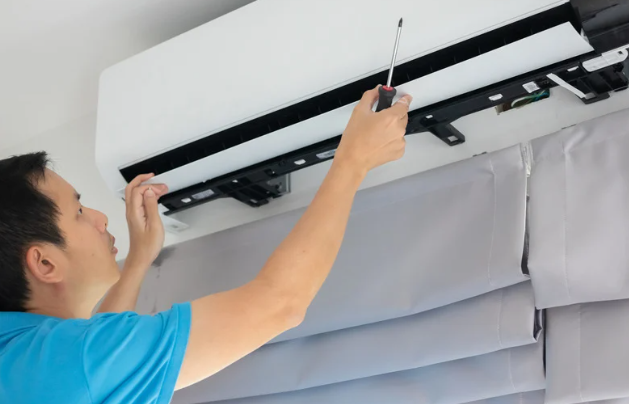 Whole-home air purification system installation inside residential HVAC unit to improve air quality