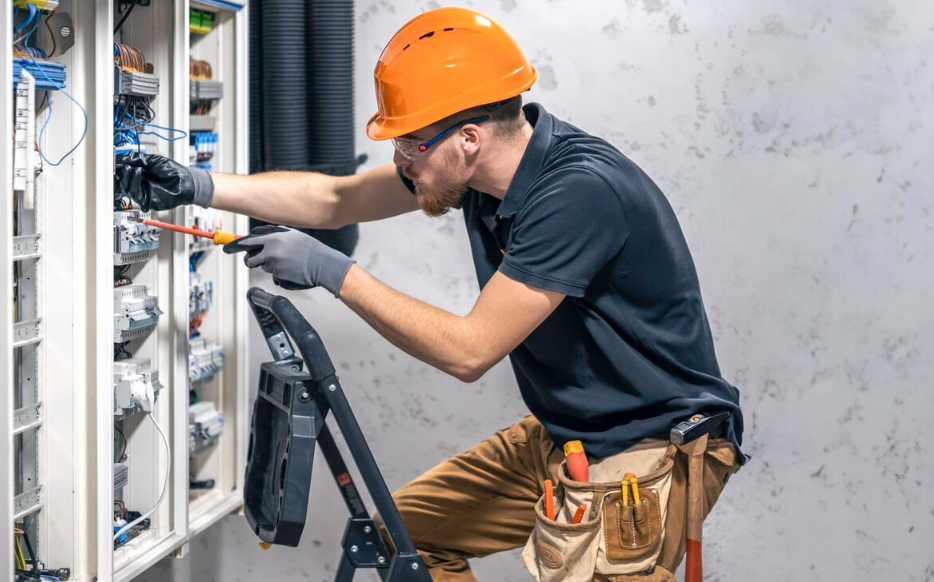 Electrician performing electrical panel upgrade to improve home electrical capacity and safety